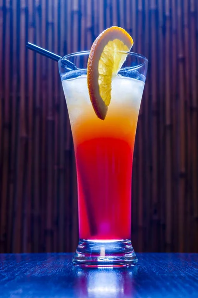 This long cocktail called Tequila Sunrise and the ingredients are Tequila Silver, Orange Juice, Grenadine syrup and Ice.
