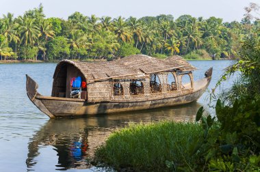 Backwaters in Kerala is a network of 1500 km of canals both manmade and natural, 38 rivers and 5 big lakes extending from one end of Kerala to the other. clipart
