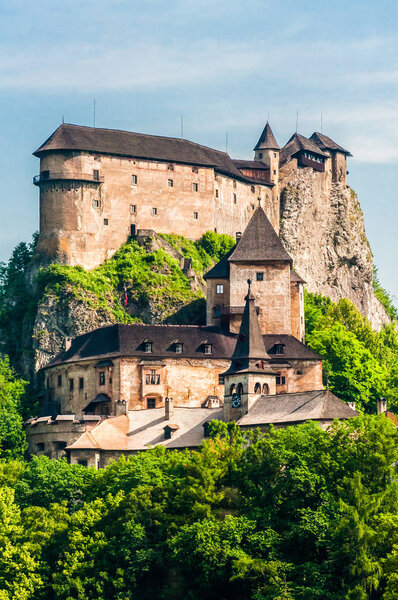 Oravsky, Slovakia - June 19, 2013. Orava Castle or Oravsk hrad is situated on a high rock above Orava river in the village of Oravsk Podzmok, Slovakia. It is the most beautiful castles in Slovakia.
