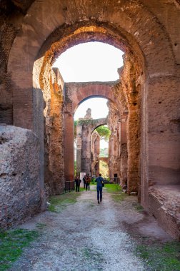 Rome, Italy - November 17, 2018: People in arches gallery hall in Domus Severiana which is the modern name given to the final extension to the imperial palaces on the Palatine Hill in Rome clipart