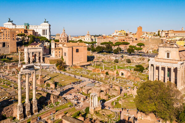 Rome, Italy - November 17, 2018: The Roman Forum, Forum Romanum is rectangular forum surrounded by ruins of several important ancient government buildings at the center of the city of Rome
