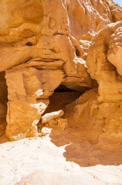 Interesting shapes of caves, rocks, cliffs of ancient cooper mines canyons and mountains range in Timna National Park in Israel clipart