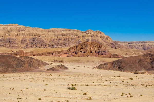 Desolation of the desert. The road, walking paths, tracks and trails through the rocky mountains and landscapes of Timna National Park in Aravah valley desert in Israel