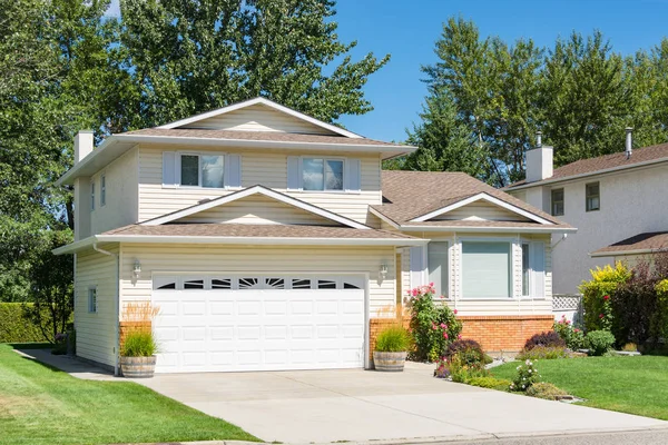 A perfect neighbourhood. Family house with concrete driveway on