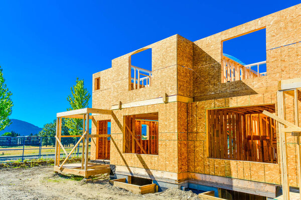 New family house under construction on sunny day.