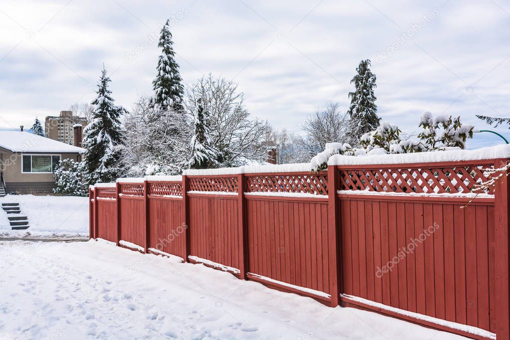 Wooden fence along a road on winter season in Vancouver, Canada
