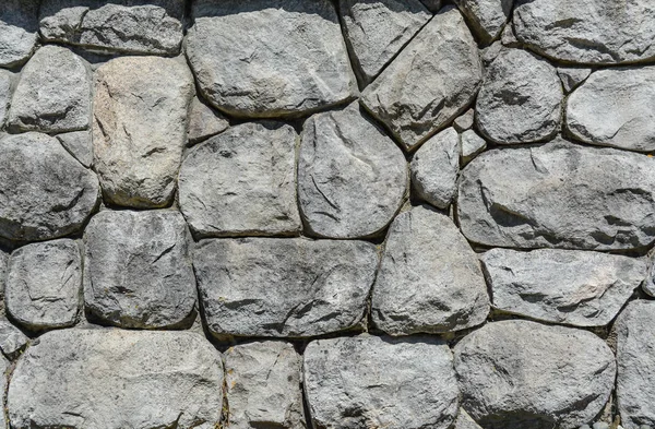 Piedras grises en fondo de textura de pared. Material de construcción moderno . — Foto de Stock