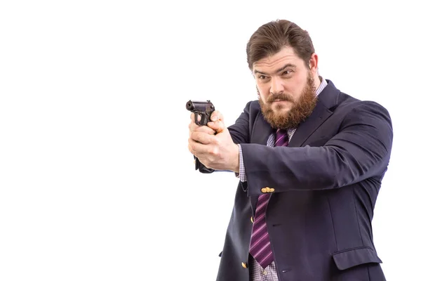 Portrait of a big handsome serious bearded business man with gun — Stock Photo, Image