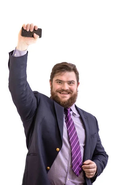 Big funny smiling bearded business man using mobile smart phone, isolated on white — Stock Photo, Image