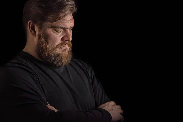 Close-up face profile portrait strong serious brutal bearded man