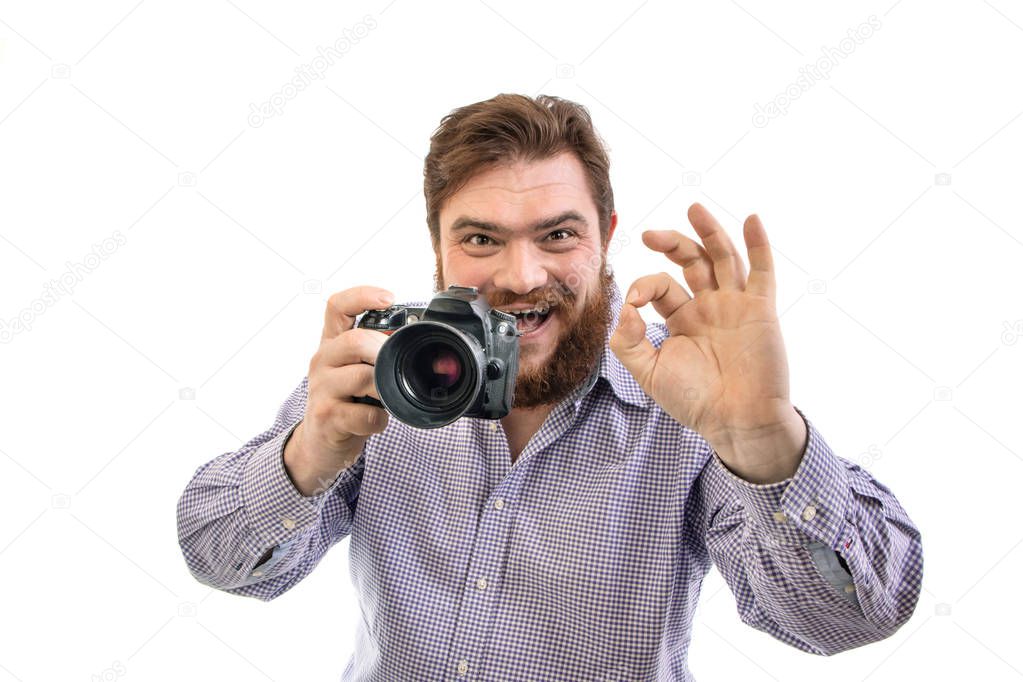 portrait of big handsome bearded photographer taking photo with 