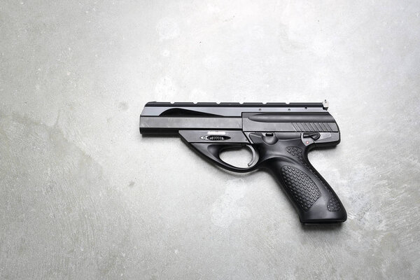 Glock. Gun on a gray background.