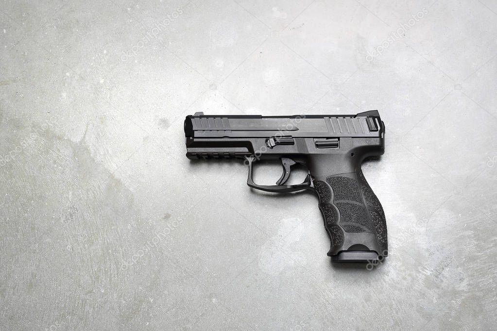 Glock. Gun on a gray background.