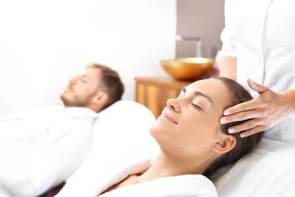 Couple in a wellness salon. A woman and a man together on a care treatment in a spa salon.