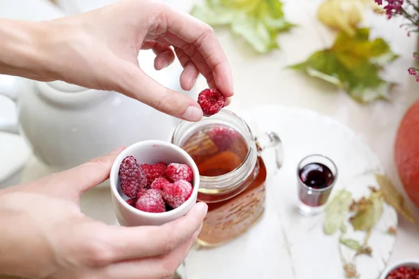 Tea with raspberries. Fruit tea. Aromatic hot tea with raspberries