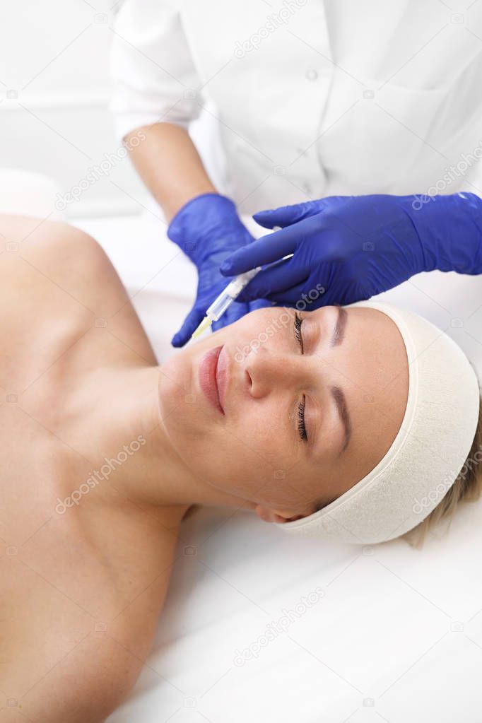 Cleavage lift. Acidic skin injection.  A patient in a cosmetic clinic, a beautician performs an injection procedure.