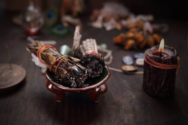 Divination and spells. Incense with white sage and cedar herbs. clipart