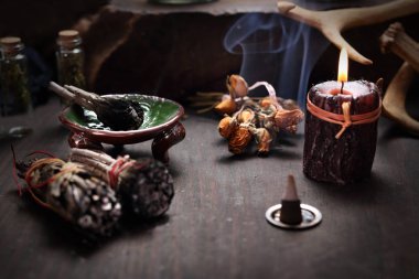 Fairy. Herbal incense and mysterious accessories on the table. clipart