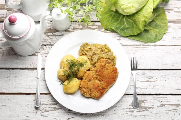 Traditional pork chop with potatoes and fried cabbage. — Stock Photo, Image