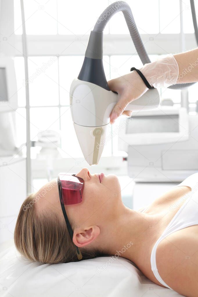 Laser hair removal, mustache hair removal. Woman in a laser hair removal salon