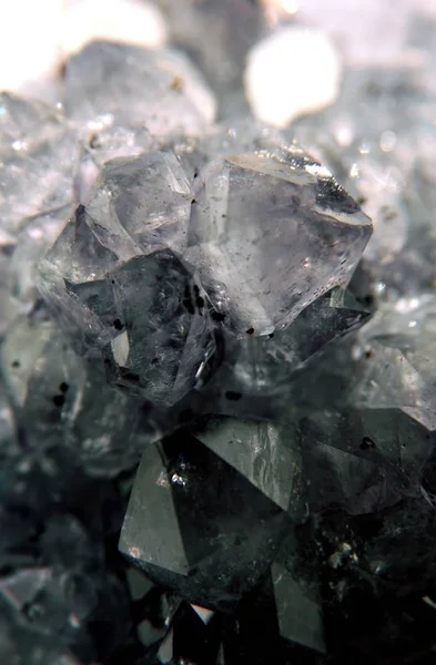 Gemstone Quartz closeup as a part of cluster geode filled with rock crystals.