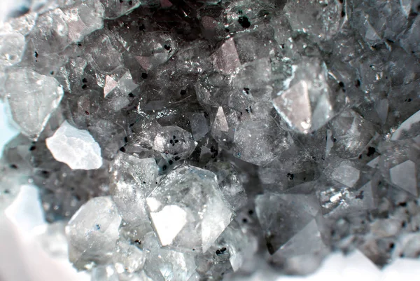 Gemstone Quartz closeup as a part of cluster geode filled with rock crystals.