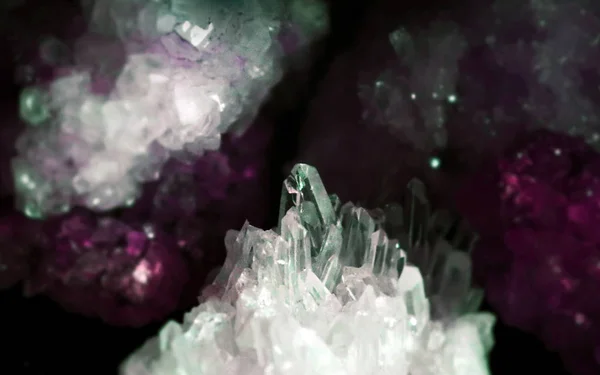 Gemstone closeup composition as a part of a cluster filled with rock crystals.