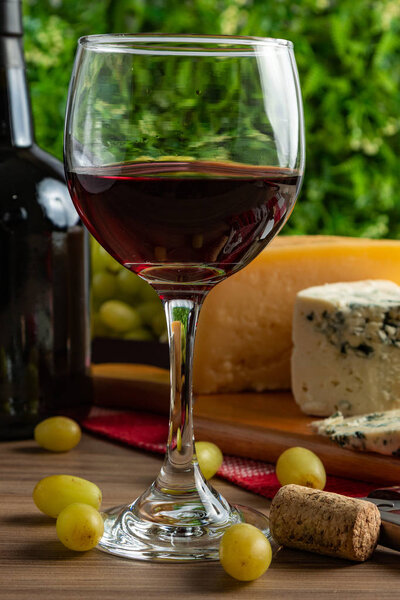 wine table with cheese and grapes
