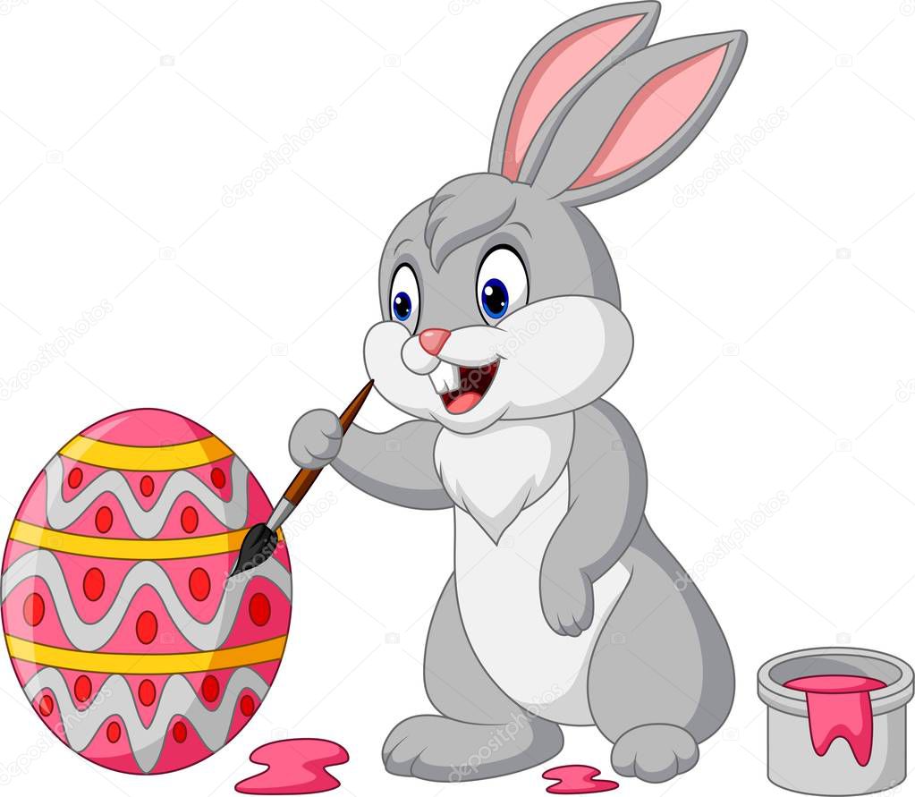 Vector illustration of Cartoon rabbit painting an Easter egg