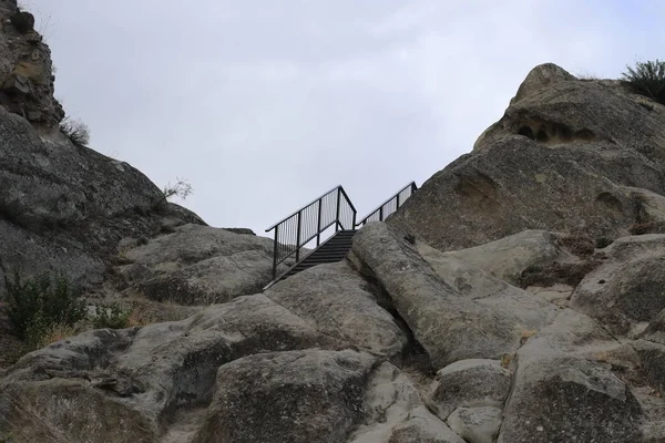 Metal stair on rock