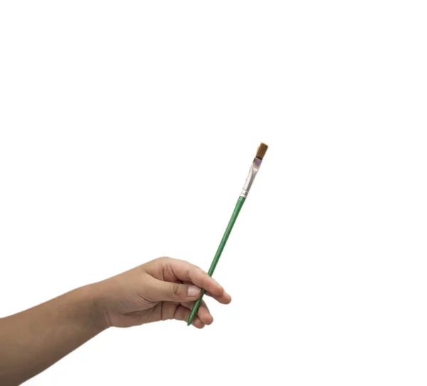 Måla pensel i handen och fingrar på vitt — Stockfoto