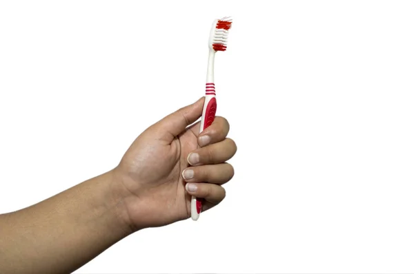 Holding tooth brush with fingers on white — Stock Photo, Image