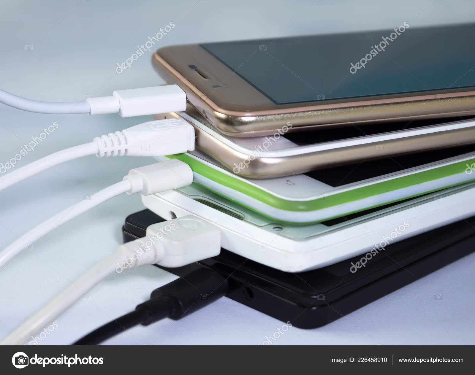 Pile Smartphones Charging Usb Cables Stock Photo by ©MilenG 226458910