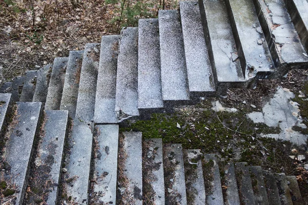 Old concrete stairs crossing in different directions