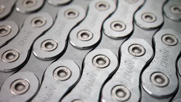 Chaîne de bicyclette posée dans un motif sans fin. Animation en boucle. Gros plan .