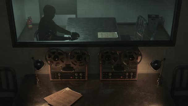 Interrogation Room Behind One Way Mirror Glass Reel To Reel Recording Interview With A Handcuffed Man Camera Track In