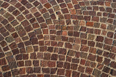 Arka plan eski Arnavut kaldırımlı kaplama. Kahverengi genel makamı.