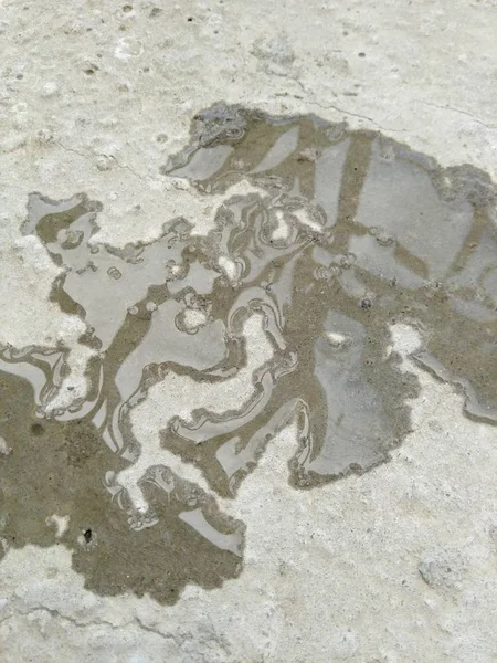 water spilled on concrete