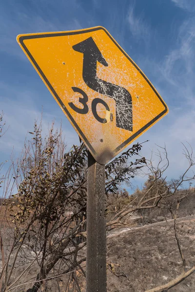 Road sign damaged by Thomas Fire along Highway 150