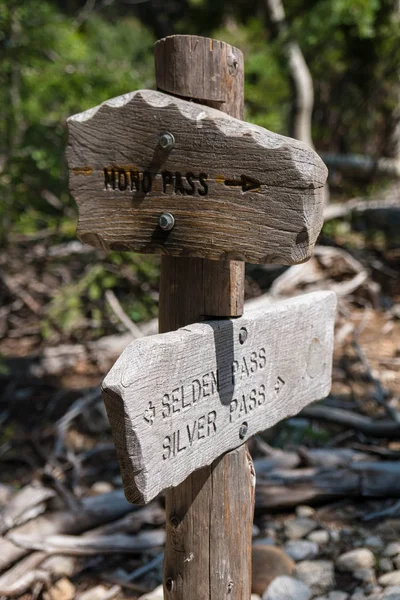 Weather worn wooden trail signs along the John Muir Trail in California