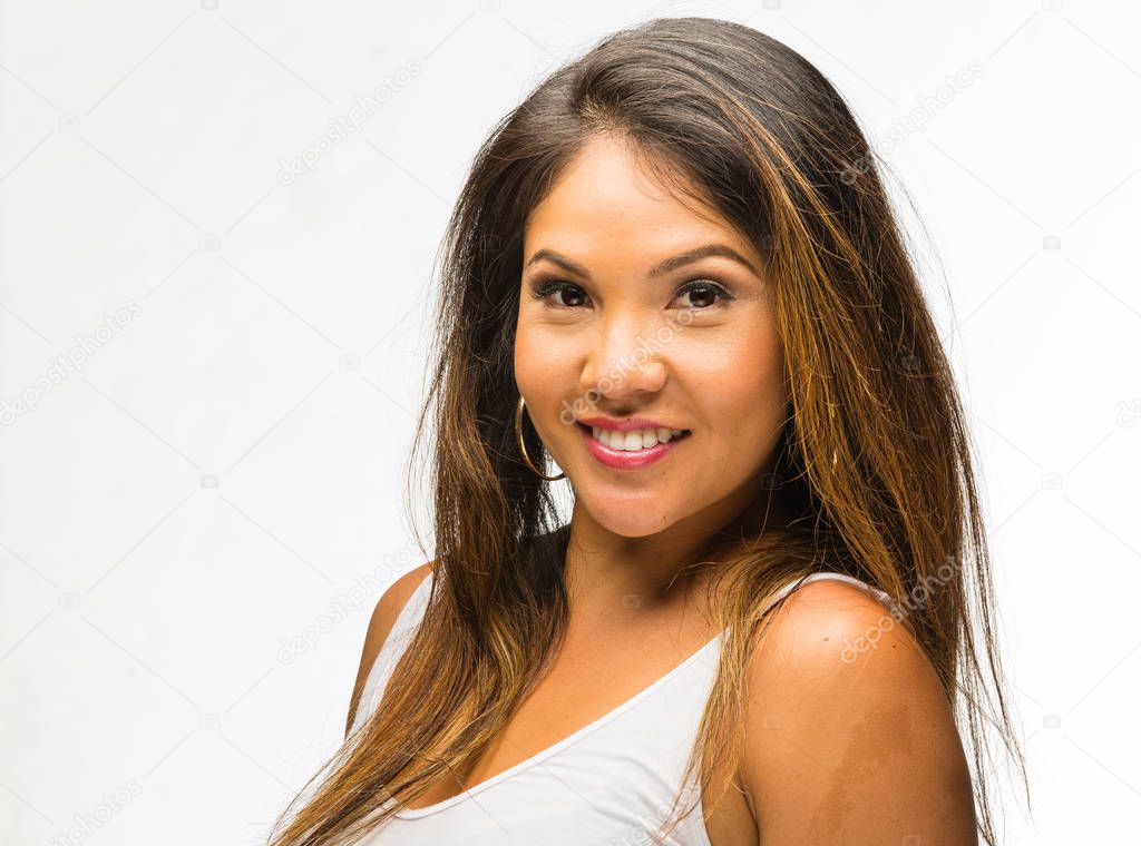 young Pacific Islander woman in white top headshot against clean white background