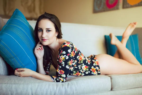 Young Caucasian Woman Floral Leotard Bare Legs Reclines Sofa — Stock Photo, Image