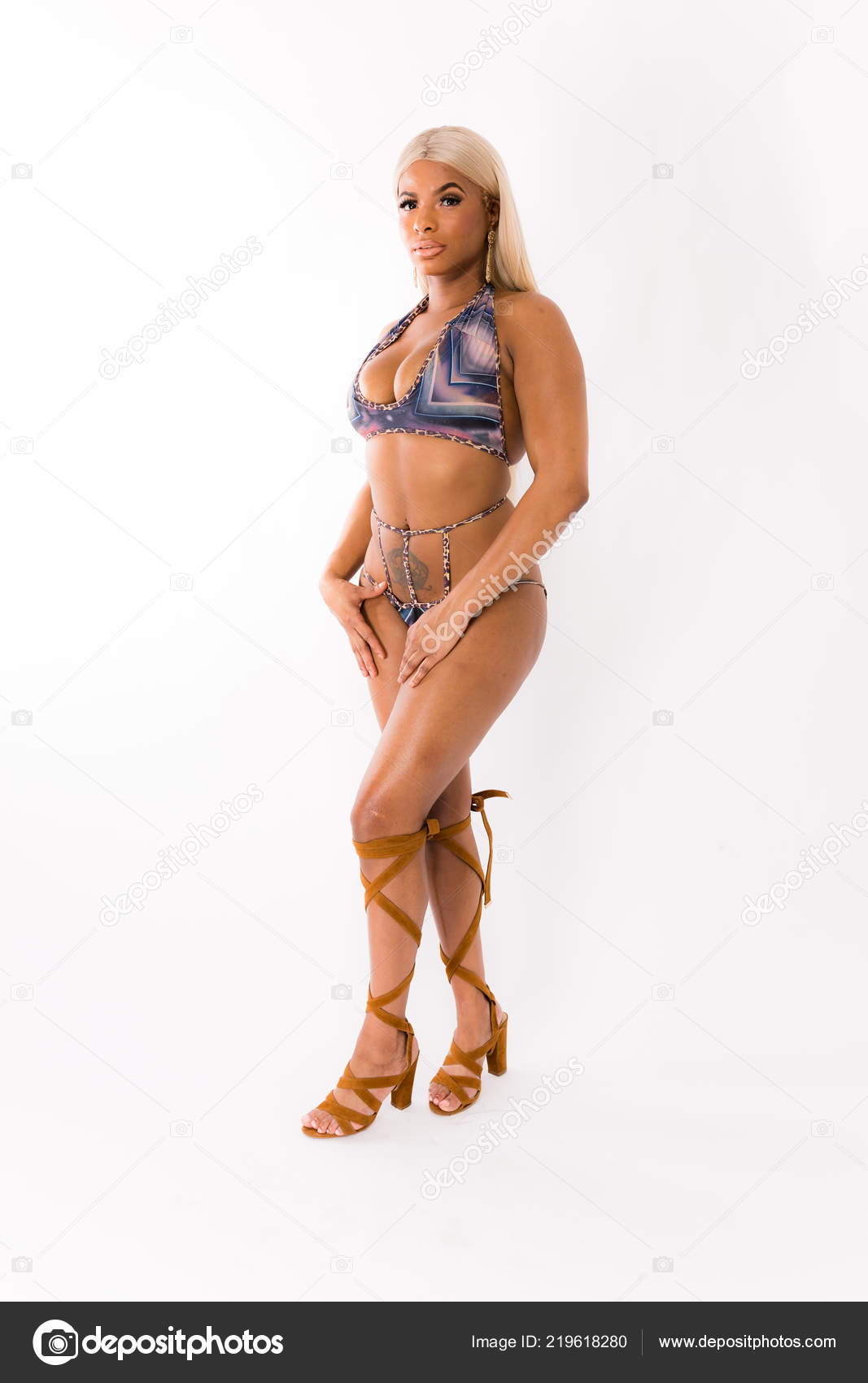 Fit Young Mixed Race Woman Long Blonde Hair Poses Striped Stock