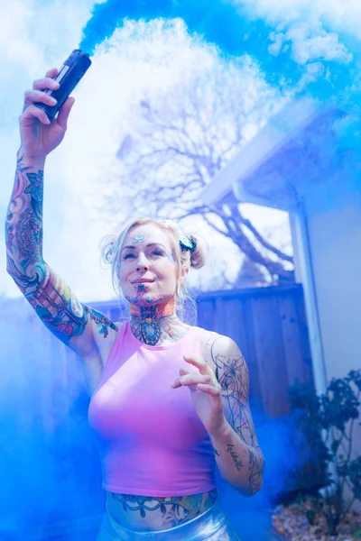 Wide Portrait Blonde Caucasian Woman Tattoos Using Blue Smoke Bomb — Stock Photo, Image