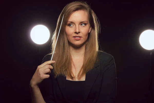 Young Caucasian Woman Conductor Poses Baton Dark Space Stage Lights — Stock Photo, Image