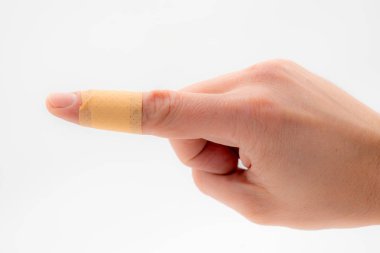 beyaz bir arka plan karşı izole işaret parmağı bir yama yardım.