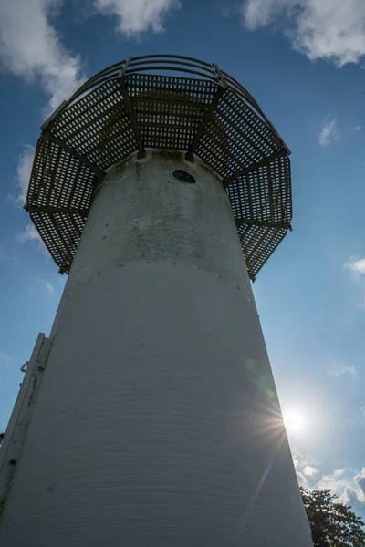 Lighthouse from a different perspective wtih blue sky