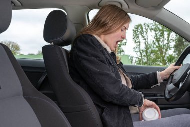 woman has spilled her coffee during the car ride