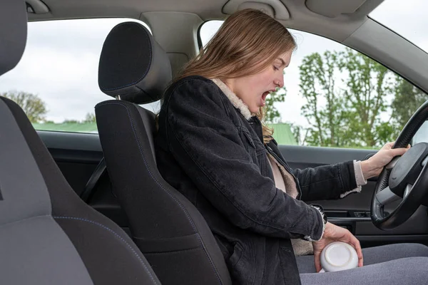 Woman has spilled her coffee during the car ride — 스톡 사진