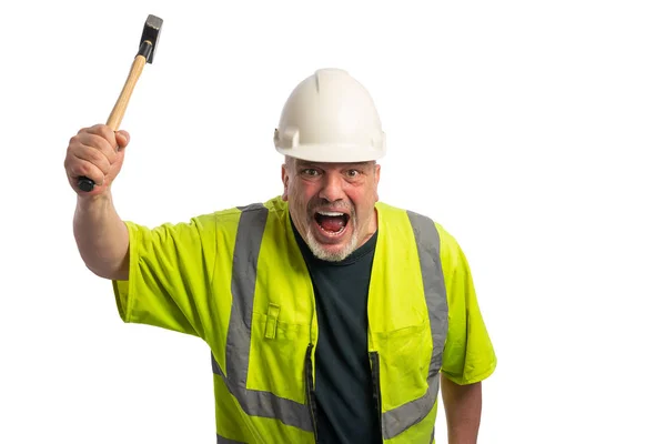 Obrero de la construcción con casco y martillo gritos y gestos salvajemente Imágenes de stock libres de derechos